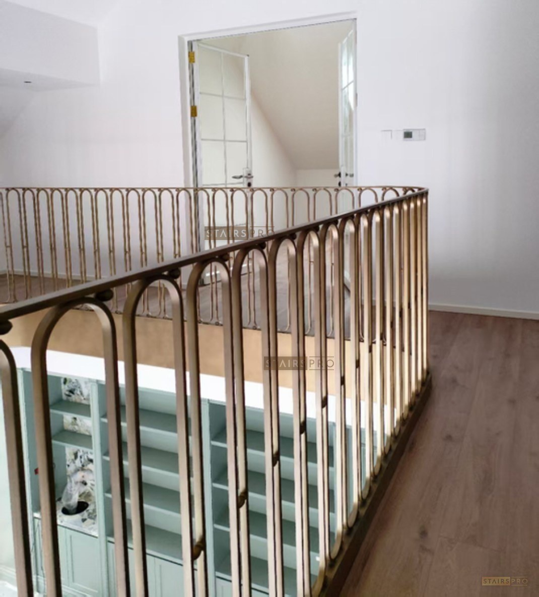 Brass balustrade on a curved staircase Brass balustrade on a curved staircase