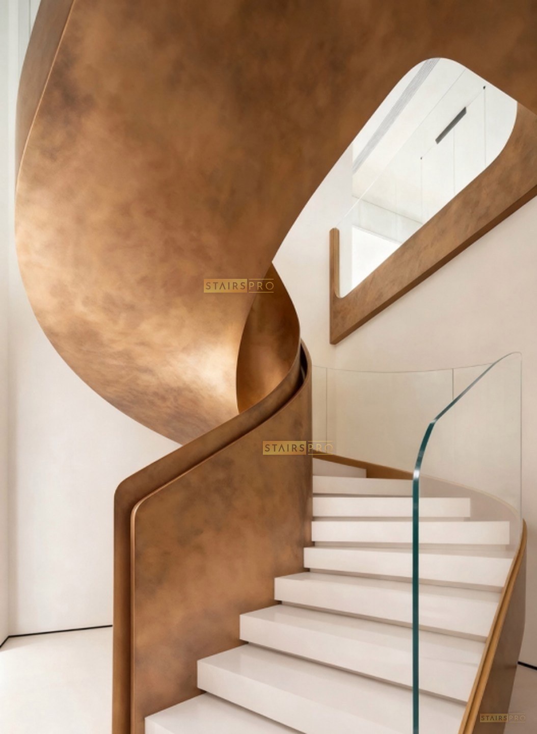 Bronze-finished curved feature staircase Bronze-finished curved feature staircase