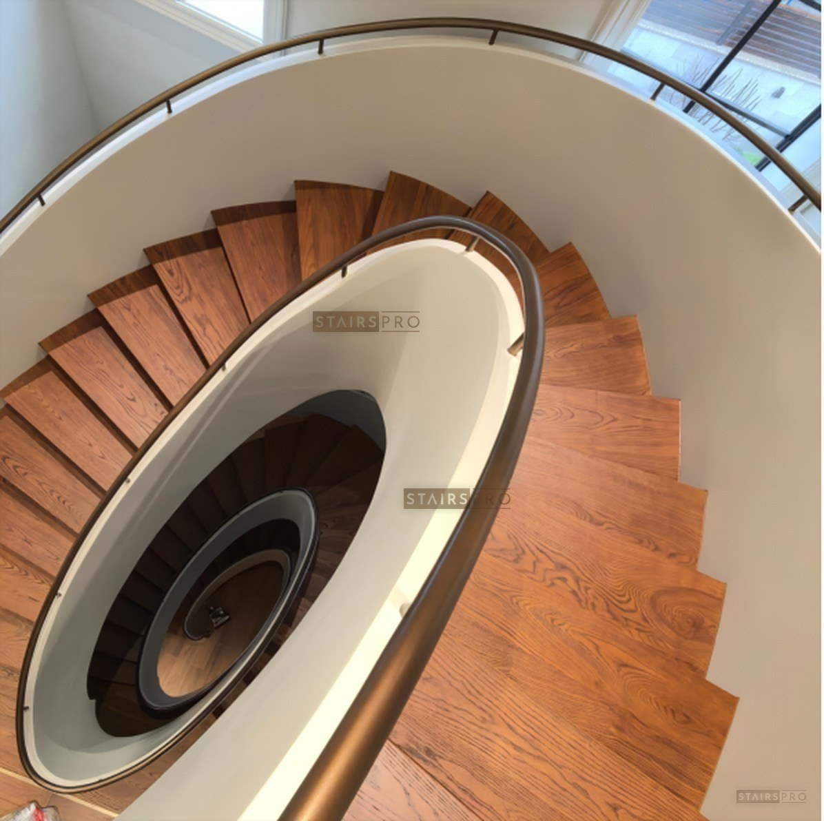 Curved staircase with solid hardwood treads Curved staircase with solid hardwood treads