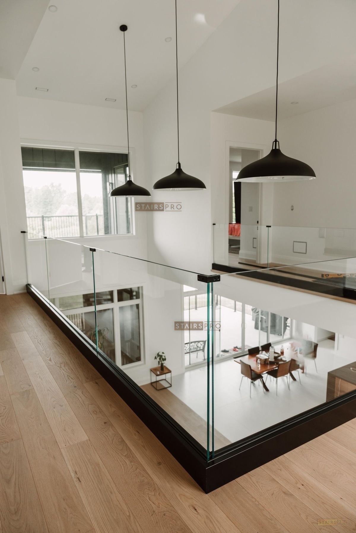 Frameless glass railing installed on a staircase landing