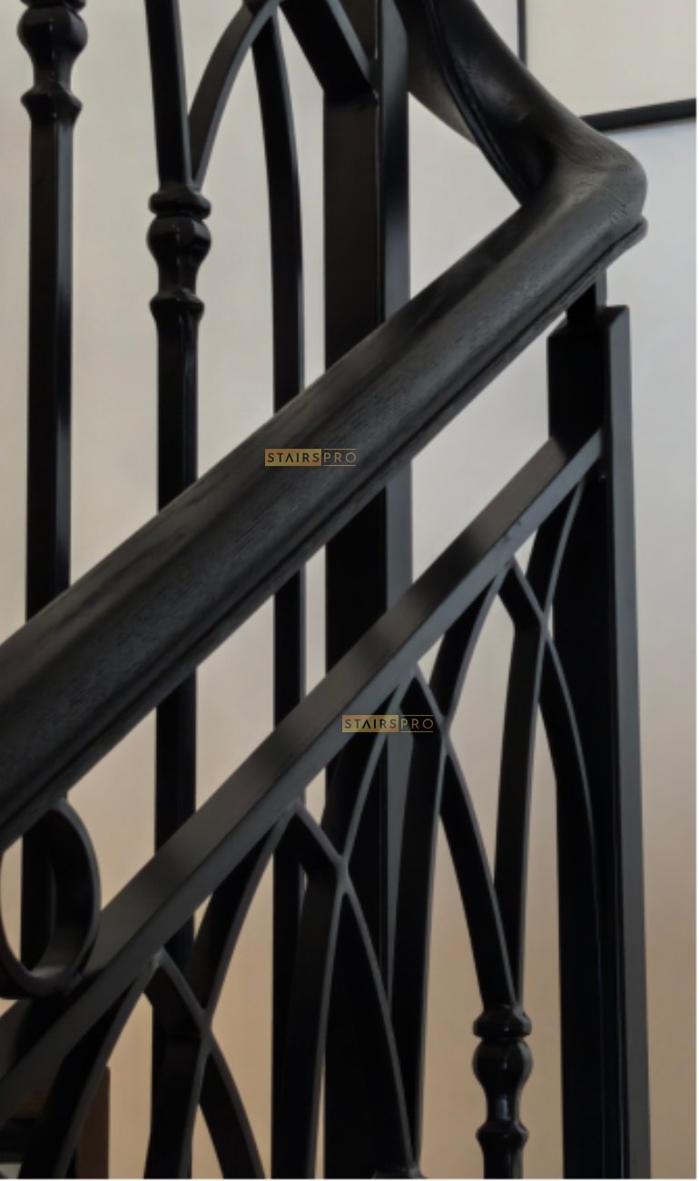 Forged iron baluster detail with a moulded handrail