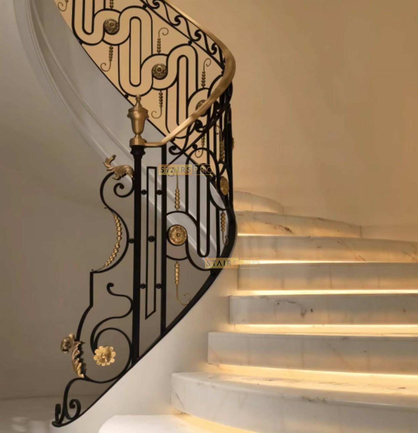 Gilded handrail over a hand-forged iron panel with brass rosettes