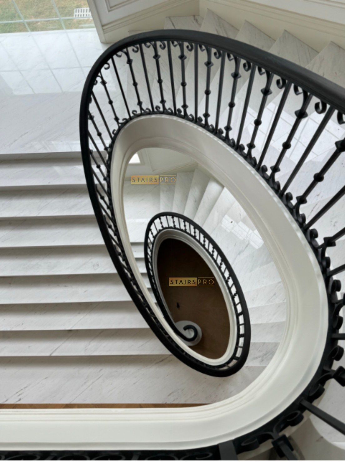 Traditional scrolled wrought iron balustrade on a helical staircase