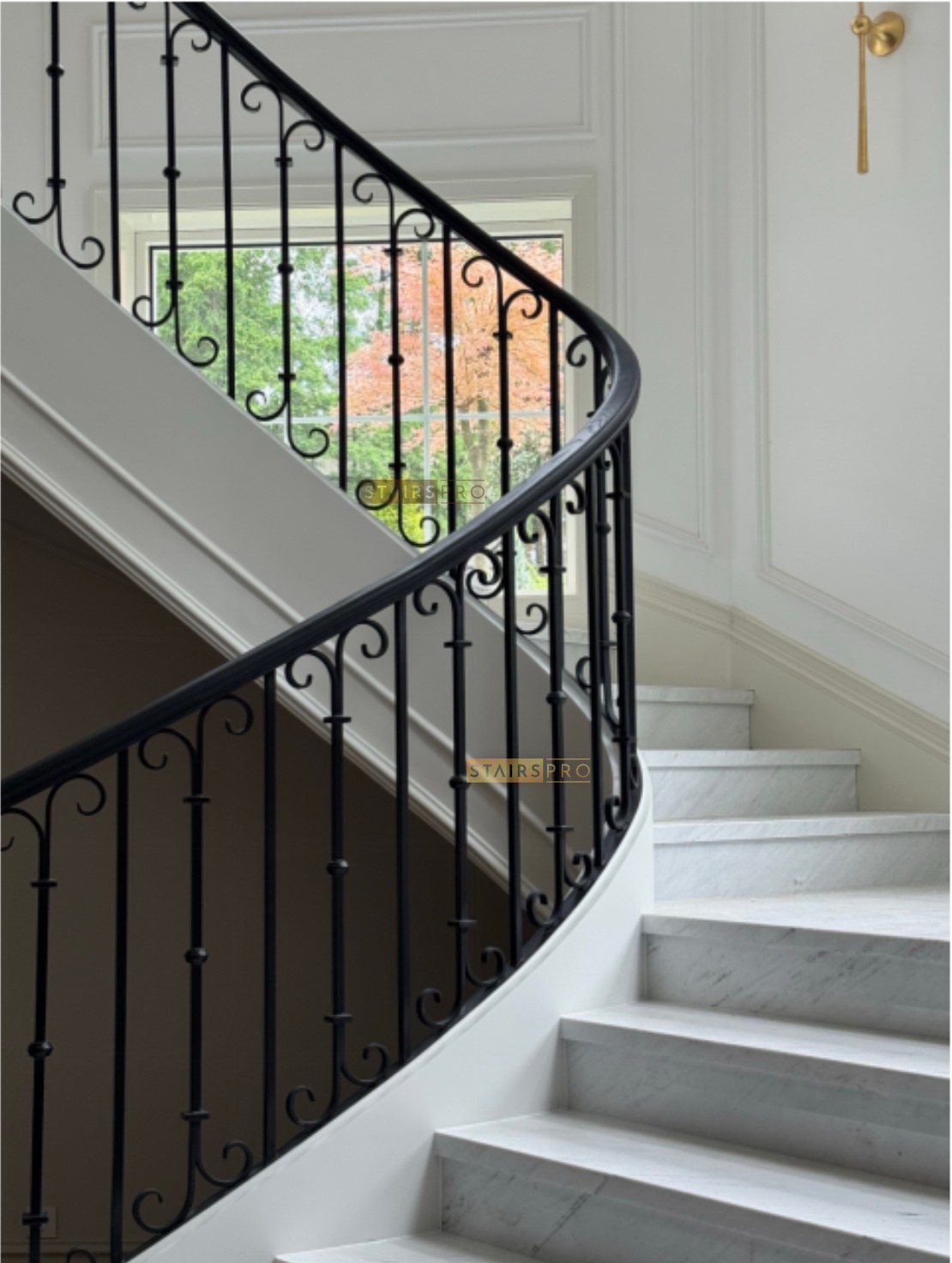 Hand-forged wrought iron balustrade on a stone staircase