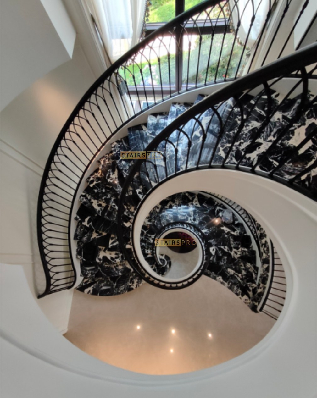 Ornamental wrought iron balustrade on a geometrical staircase