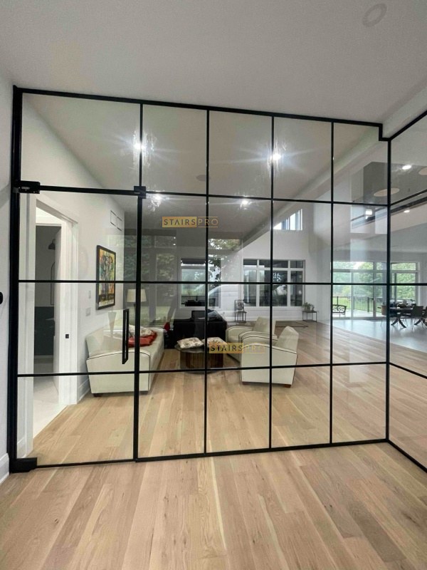 Framed glass partition with a sliding door to a study