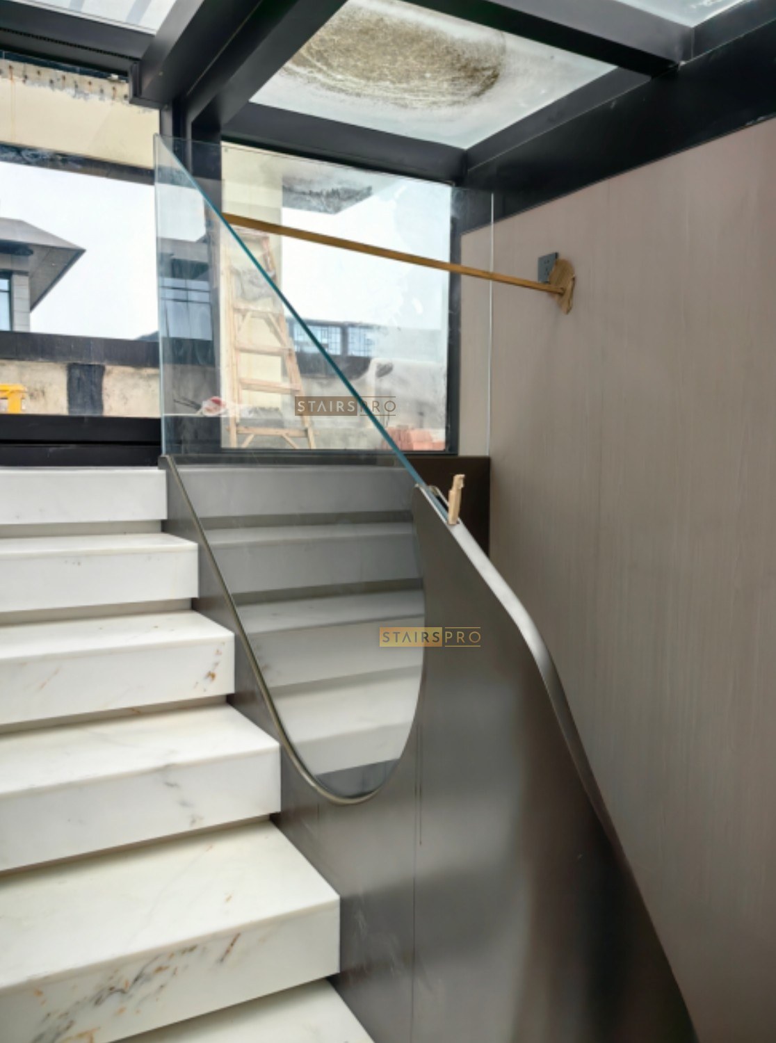 Laser cut steel balustrade with a brass handrail