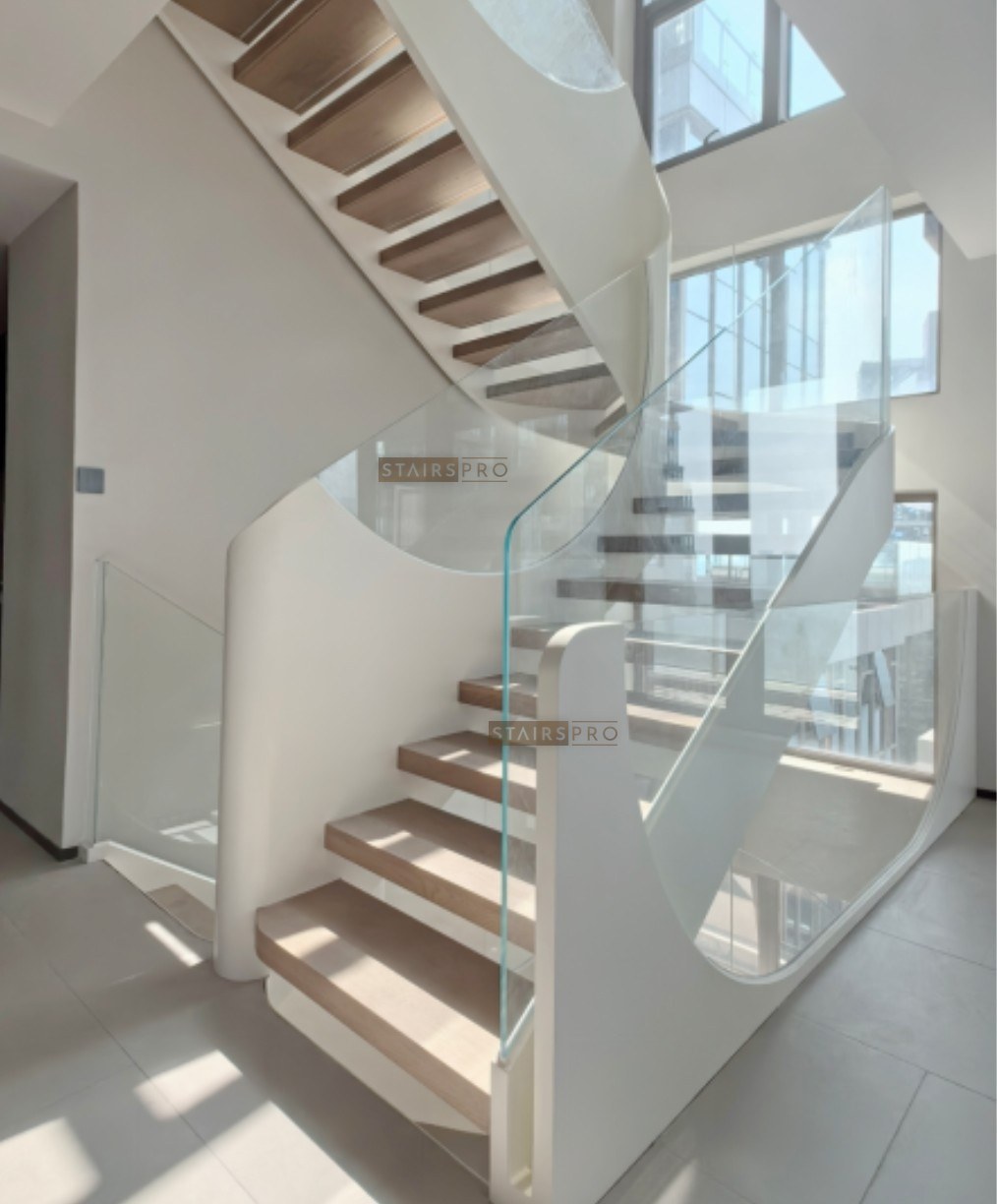 White sculptural steel balustrade on a curved staircase