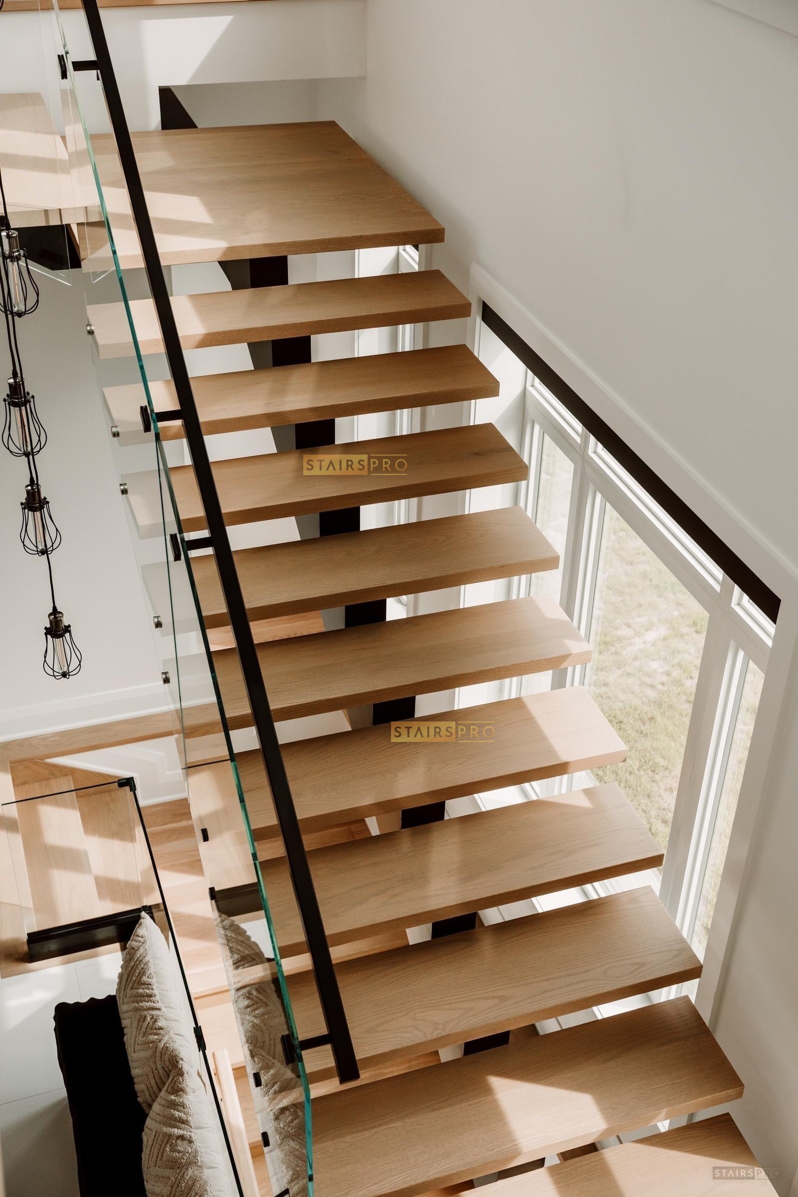 Standoff glass railing on a staircase flight