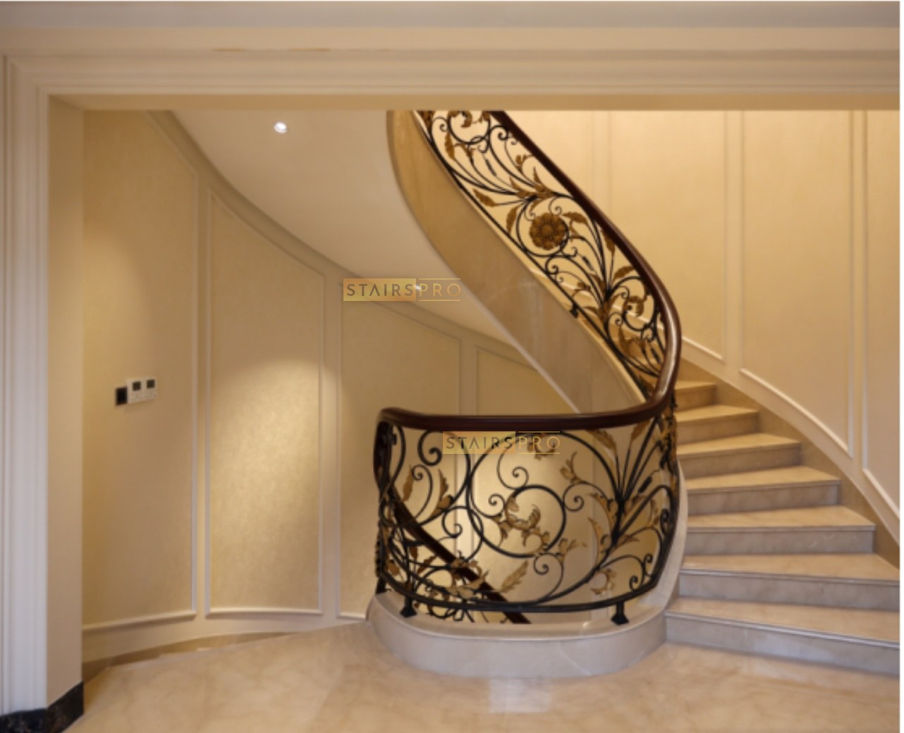Staircase with a hand-forged wrought iron balustrade in an entrance hall Staircase with a hand-forged wrought iron balustrade in an entrance hall